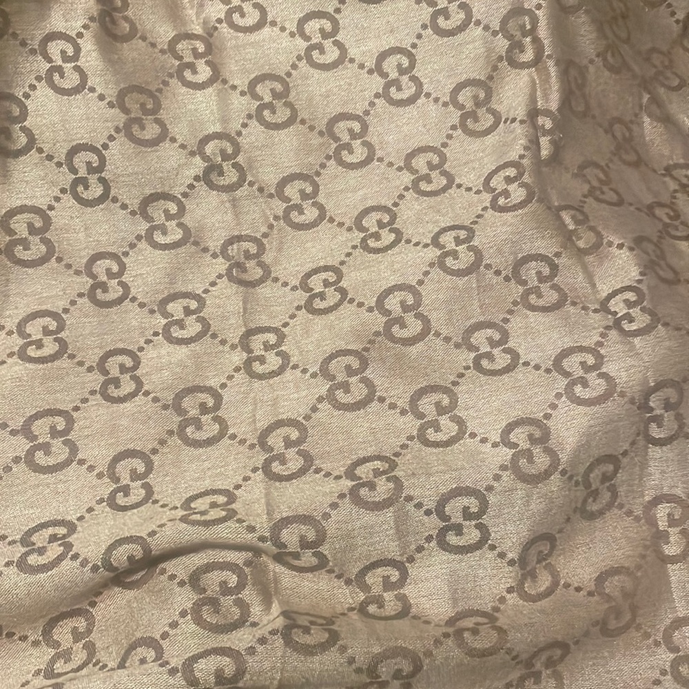 Gucci scarf never worn in mint condition will accept offers as well!